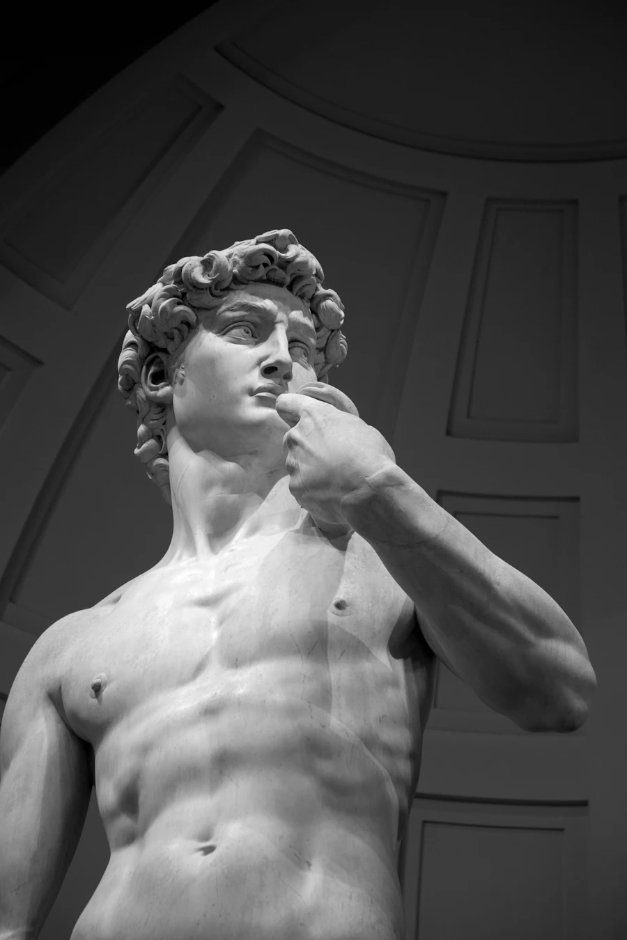 Classical marble statue overlooking the Kleos AI sales command interface